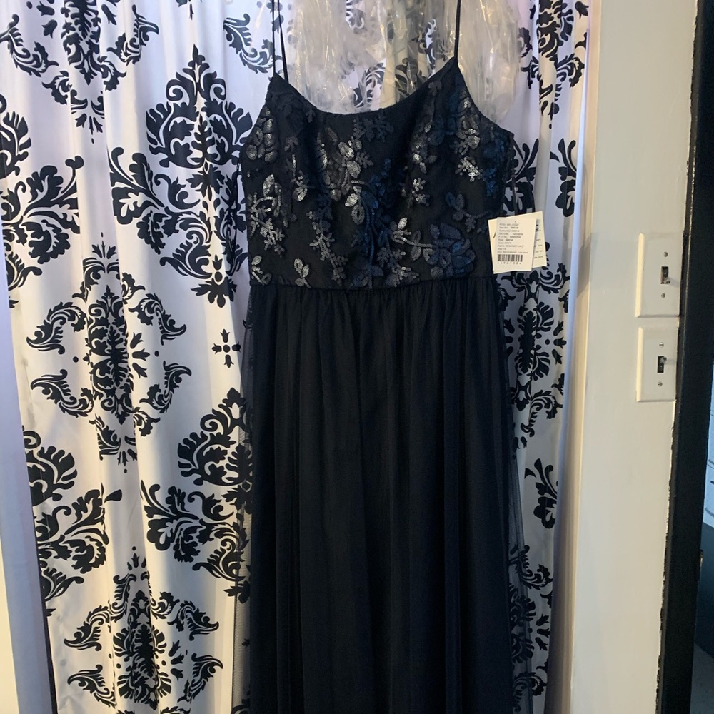 Brand new, never worn navy dress with sequin overlay on the top and tulle skirt